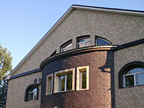 Фото дома обшитого фасадными панелями Docke-R Бург