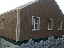 Дом с отделкой фасадными панелями Деке-Р Stein